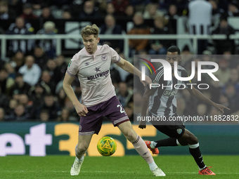 Brentford's Nathan Collins competes with Newcastle United's Alexander Isak during the Carabao Cup Quarter Final match between Newcastle Unit...