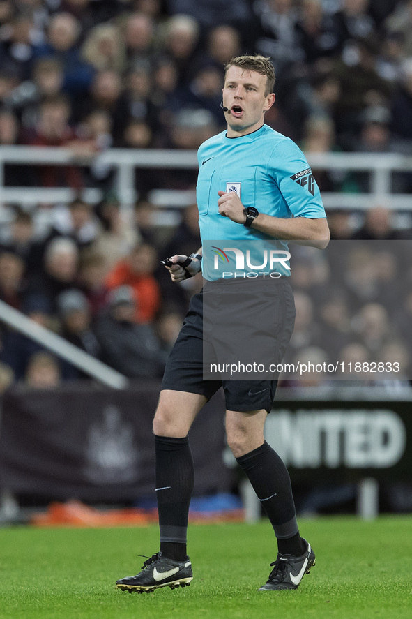 Match referee Samuel Barrott officiates during the Carabao Cup Quarter Final match between Newcastle United and Brentford at St. James's Par...