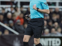 Match referee Samuel Barrott officiates during the Carabao Cup Quarter Final match between Newcastle United and Brentford at St. James's Par...