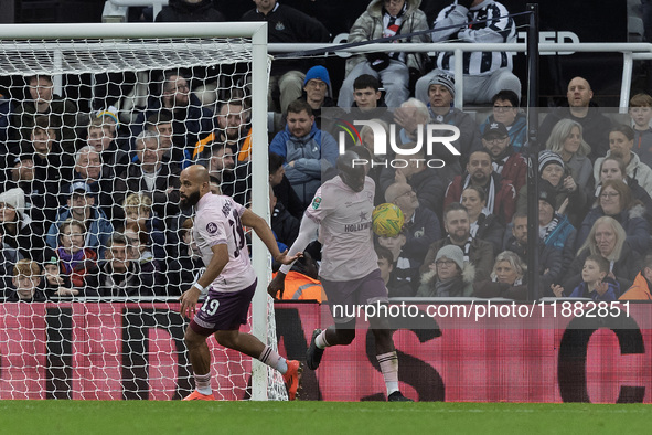 Bryan Mbeumo celebrates with Yoane Wissa after he scores during the Carabao Cup Quarter Final match between Newcastle United and Brentford a...