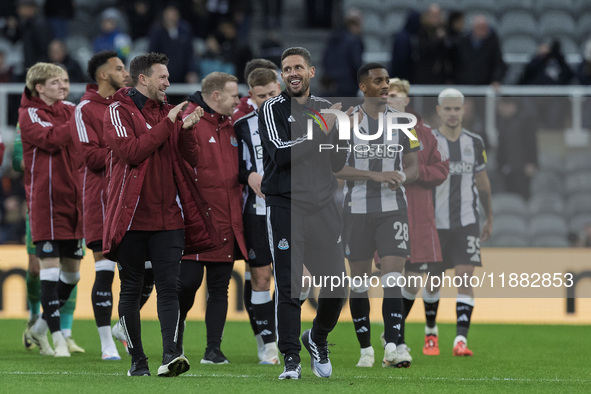 Newcastle United's assistant manager Jason Tindall (in a black tracksuit) applauds their fans after the Carabao Cup Quarter Final match betw...