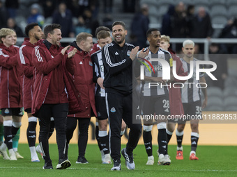 Newcastle United's assistant manager Jason Tindall (in a black tracksuit) applauds their fans after the Carabao Cup Quarter Final match betw...