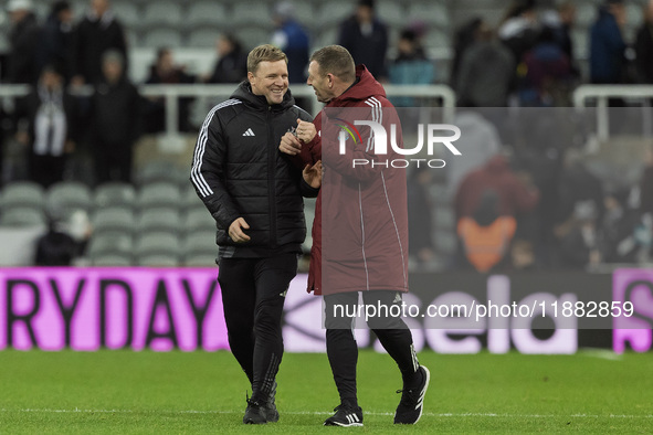 Newcastle United manager Eddie Howe and assistant manager Graeme Jones applaud their supporters after the Carabao Cup Quarter Final match be...