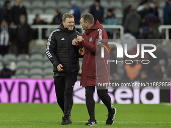 Newcastle United manager Eddie Howe and assistant manager Graeme Jones applaud their supporters after the Carabao Cup Quarter Final match be...