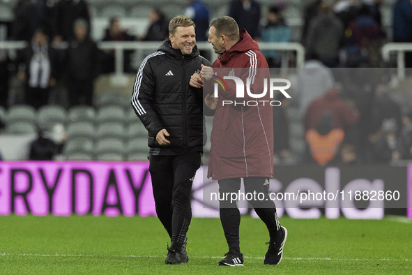 Newcastle United manager Eddie Howe and assistant manager Graeme Jones applaud their supporters after the Carabao Cup Quarter Final match be...