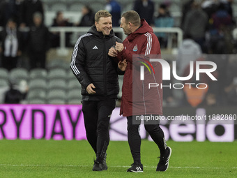 Newcastle United manager Eddie Howe and assistant manager Graeme Jones applaud their supporters after the Carabao Cup Quarter Final match be...