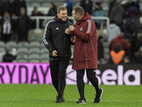 Newcastle United manager Eddie Howe and assistant manager Graeme Jones applaud their supporters after the Carabao Cup Quarter Final match be...