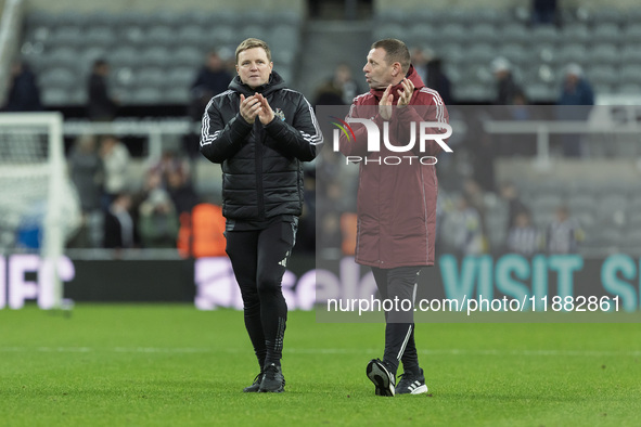 Newcastle United manager Eddie Howe and assistant manager Graeme Jones applaud their supporters after the Carabao Cup Quarter Final match be...