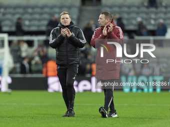 Newcastle United manager Eddie Howe and assistant manager Graeme Jones applaud their supporters after the Carabao Cup Quarter Final match be...