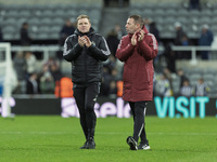 Newcastle United manager Eddie Howe and assistant manager Graeme Jones applaud their supporters after the Carabao Cup Quarter Final match be...