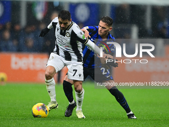 Alexis Sanchez of Udinese Calcio and Kristjan Aslani of Inter Milan battle for the ball during the Coppa Italia Frecciarossa match between I...