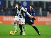 Alexis Sanchez of Udinese Calcio and Kristjan Aslani of Inter Milan battle for the ball during the Coppa Italia Frecciarossa match between I...