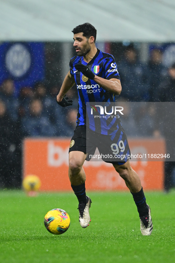 Mehdi Taremi of Inter Milan is in action during the Coppa Italia Frecciarossa match between Inter Milan and Udinese Calcio at Giuseppe Meazz...