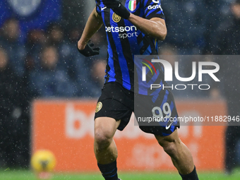 Mehdi Taremi of Inter Milan is in action during the Coppa Italia Frecciarossa match between Inter Milan and Udinese Calcio at Giuseppe Meazz...