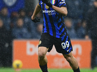 Mehdi Taremi of Inter Milan is in action during the Coppa Italia Frecciarossa match between Inter Milan and Udinese Calcio at Giuseppe Meazz...