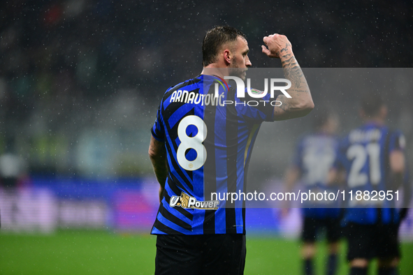 Marko Arnautovic of Inter Milan celebrates after scoring his team's first goal during the Coppa Italia Frecciarossa match between Inter Mila...