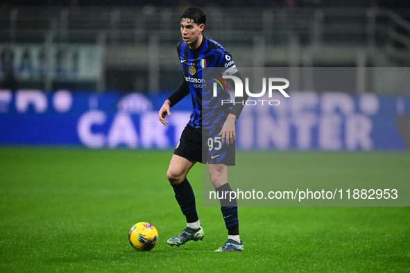 Alessandro Bastoni of Inter Milan is in action during the Coppa Italia Frecciarossa match between Inter Milan and Udinese Calcio at Giuseppe...