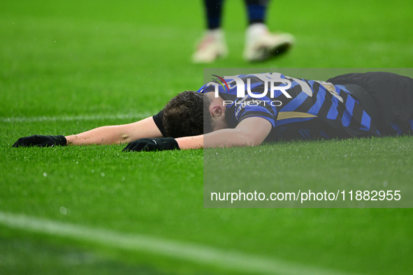 Carlos Augusto of Inter Milan lies on the ground during the Coppa Italia Frecciarossa match between Inter Milan and Udinese Calcio at Giusep...