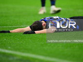 Carlos Augusto of Inter Milan lies on the ground during the Coppa Italia Frecciarossa match between Inter Milan and Udinese Calcio at Giusep...