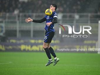 Alessandro Bastoni of Inter Milan is in action during the Coppa Italia Frecciarossa match between Inter Milan and Udinese Calcio at Giuseppe...