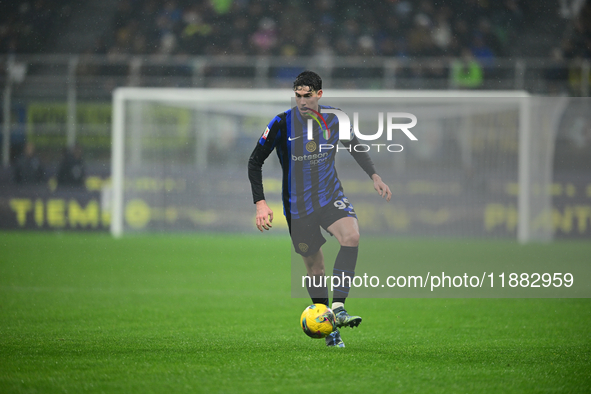 Alessandro Bastoni of Inter Milan is in action during the Coppa Italia Frecciarossa match between Inter Milan and Udinese Calcio at Giuseppe...