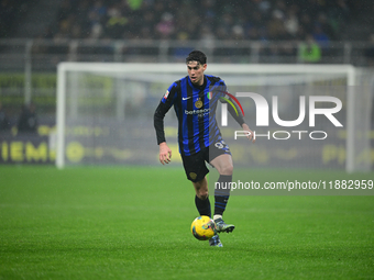 Alessandro Bastoni of Inter Milan is in action during the Coppa Italia Frecciarossa match between Inter Milan and Udinese Calcio at Giuseppe...