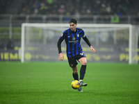 Alessandro Bastoni of Inter Milan is in action during the Coppa Italia Frecciarossa match between Inter Milan and Udinese Calcio at Giuseppe...