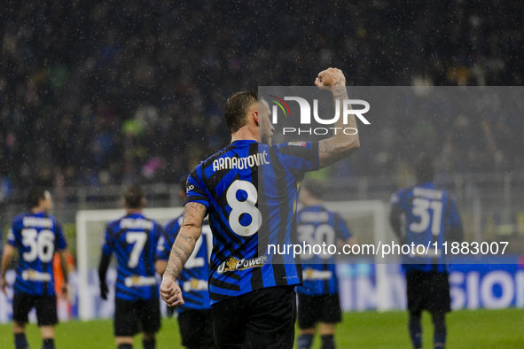 Marko Arnautovic celebrates the goal during the Coppa Italia match between FC Internazionale and Udinese Calcio at Giuseppe Meazza Stadium i...