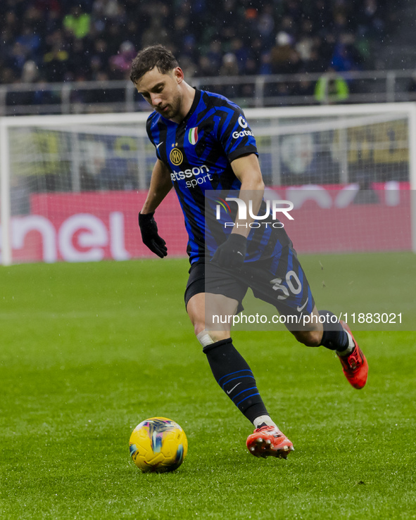 Carlos Augusto plays during the Coppa Italia match between FC Internazionale and Udinese Calcio at Giuseppe Meazza Stadium in Milano, Italy,...