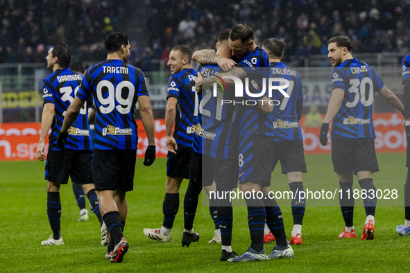 Carlos Augusto and Kristjan Asllani celebrate the goal during the Coppa Italia match between FC Internazionale and Udinese Calcio at Giusepp...