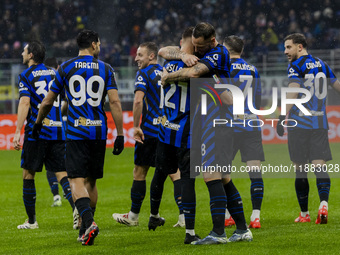 Carlos Augusto and Kristjan Asllani celebrate the goal during the Coppa Italia match between FC Internazionale and Udinese Calcio at Giusepp...