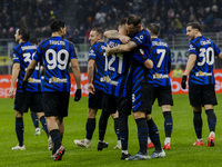 Carlos Augusto and Kristjan Asllani celebrate the goal during the Coppa Italia match between FC Internazionale and Udinese Calcio at Giusepp...