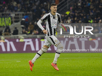 Lorenzo Lucca plays during the Coppa Italia match between FC Internazionale and Udinese Calcio in Milano, Italy, on December 19, 2024, at Gi...