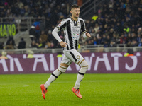 Lorenzo Lucca plays during the Coppa Italia match between FC Internazionale and Udinese Calcio in Milano, Italy, on December 19, 2024, at Gi...