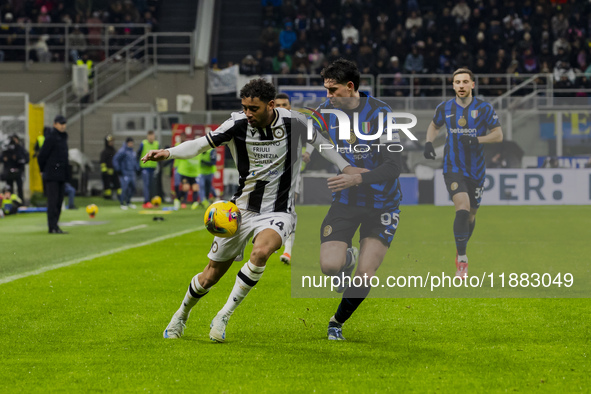 Arthur Atta and Alessandro Bastoni are in action during the Coppa Italia match between FC Internazionale and Udinese Calcio at Giuseppe Meaz...