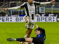 Rui Modesto and Alessandro Bastoni are in action during the Coppa Italia match between FC Internazionale and Udinese Calcio at Giuseppe Meaz...