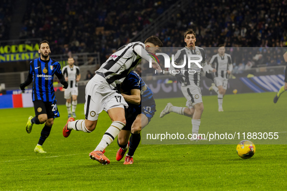 Lorenzo Lucca and Carlos Augusto play during the Coppa Italia match between FC Internazionale and Udinese Calcio at Giuseppe Meazza Stadium...