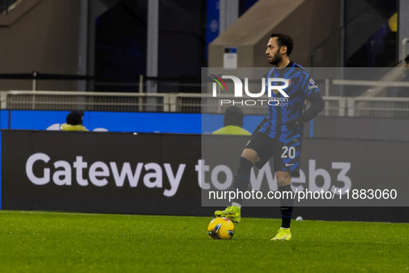 Hakan Calhanoglu plays during the Coppa Italia match between FC Internazionale and Udinese Calcio at Giuseppe Meazza Stadium in Milano, Ital...