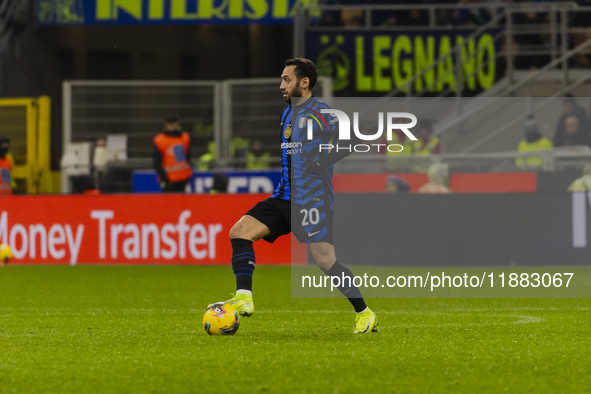 Hakan Calhanoglu plays during the Coppa Italia match between FC Internazionale and Udinese Calcio at Giuseppe Meazza Stadium in Milano, Ital...