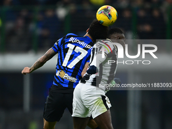 Tajon Buchanan of Inter Milan and Hassane Kamara of Udinese Calcio battle for the ball during the Coppa Italia Frecciarossa match between In...