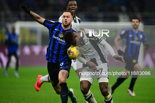 Marko Arnautovic of Inter Milan and Christian Kabasele of Udinese Calcio battle for the ball during the Coppa Italia Frecciarossa match betw...