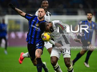 Marko Arnautovic of Inter Milan and Christian Kabasele of Udinese Calcio battle for the ball during the Coppa Italia Frecciarossa match betw...