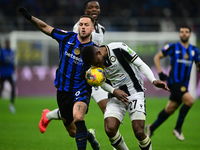 Marko Arnautovic of Inter Milan and Christian Kabasele of Udinese Calcio battle for the ball during the Coppa Italia Frecciarossa match betw...