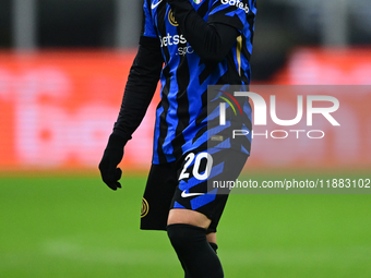 Hakan Calhanoglu of Inter Milan looks on during the Coppa Italia Frecciarossa match between Inter Milan and Udinese Calcio at Giuseppe Meazz...