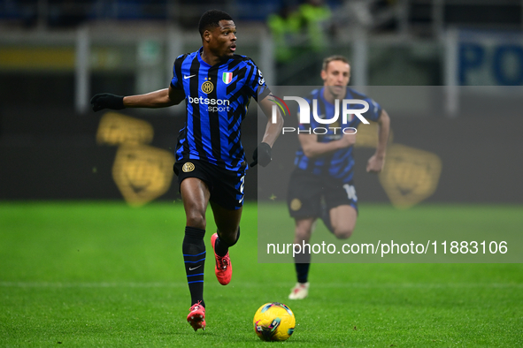 Denzel Dumfries of Inter Milan is in action during the Coppa Italia Frecciarossa match between Inter Milan and Udinese Calcio at Giuseppe Me...