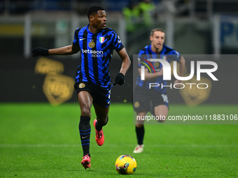 Denzel Dumfries of Inter Milan is in action during the Coppa Italia Frecciarossa match between Inter Milan and Udinese Calcio at Giuseppe Me...