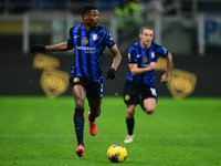 Denzel Dumfries of Inter Milan is in action during the Coppa Italia Frecciarossa match between Inter Milan and Udinese Calcio at Giuseppe Me...