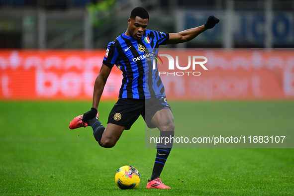 Denzel Dumfries of Inter Milan is in action during the Coppa Italia Frecciarossa match between Inter Milan and Udinese Calcio at Giuseppe Me...