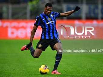 Denzel Dumfries of Inter Milan is in action during the Coppa Italia Frecciarossa match between Inter Milan and Udinese Calcio at Giuseppe Me...