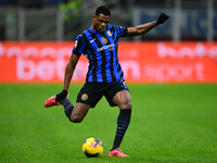 Denzel Dumfries of Inter Milan is in action during the Coppa Italia Frecciarossa match between Inter Milan and Udinese Calcio at Giuseppe Me...